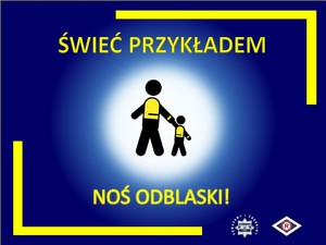 Grafika przedstawiająca dwie postacie w kamizelkach odblaskowych i jasnej poświacie, na granatowym tle. W górnej części hasło „Świeć przykładem”, poniżej „noś odblaski”