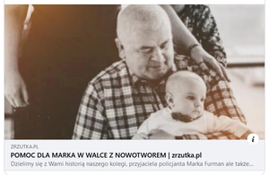 Zdjęcie mężczyzny trzymającego na rękach dziecko