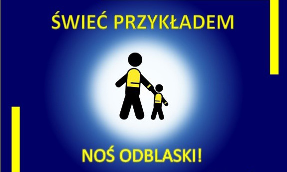 grafika promująca kampanię. W centralnej części dorosły trzymający za rękę dziecko, oboje w kamizelkach odblaskowych. W centralnej części grafiki hasło: świeć przykładem poniżej noś odblaski